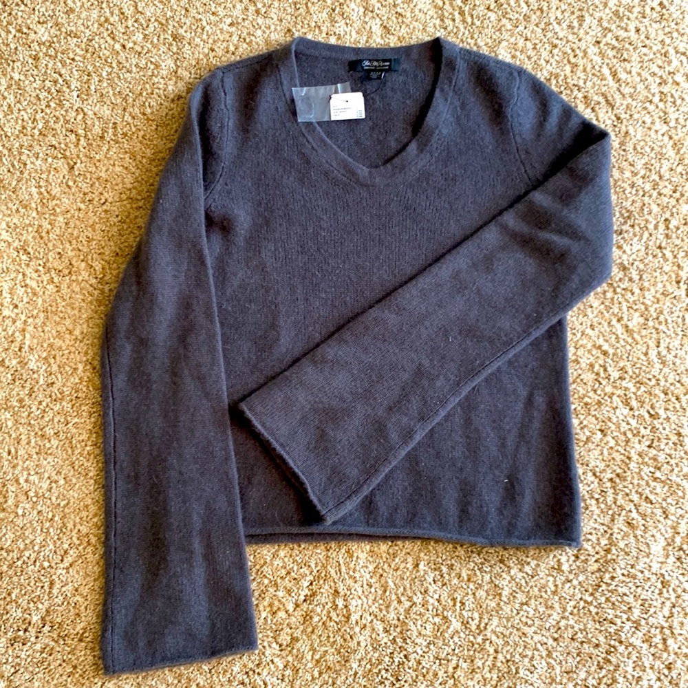 cashmere sweater, not traditional v-neck, bell sleeves. Tag says color is SAGE.